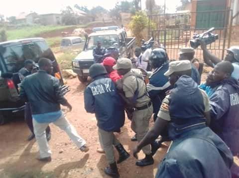 PHOTOS: Besigye Arrested as Court Drops Cases Against Bobi Wine