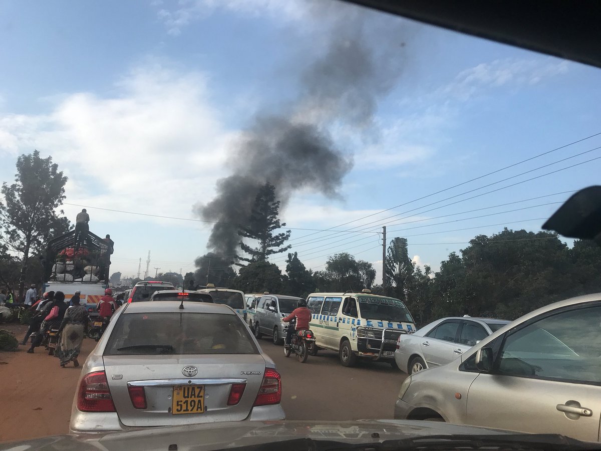 Nansana: Suspected UPDF Soldier Hits Taxi Driver with Hoe, Residents Burn His Car