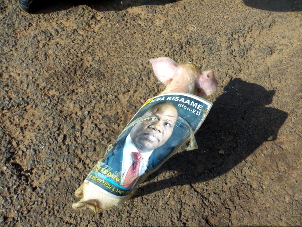 PHOTOS: Pigs Dressed in Kisaame’s Posters Dropped at Bank of Uganda