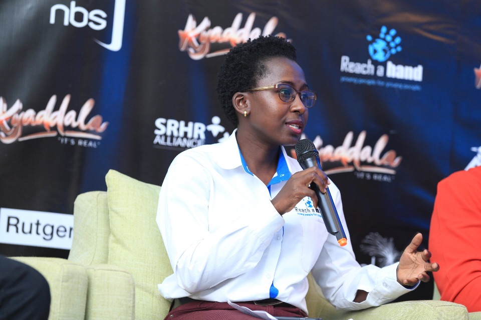 Helen Patricia Amutuhaire, the Reach A Hand Uganda representative speaking at the press launch