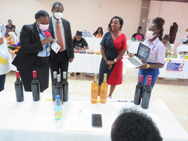 Stellah Kakwezi, Head Chattels Registry at URSB, James Wasula, Chairman GSWIM & Lillian Nantume, CEO GSWIM admire products on display during the training at Africana Hotel in Kampala.