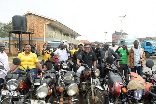 MTN Team posing in picture with the leaders of the Boda Boda Owners and Operators Association of Fort Portal