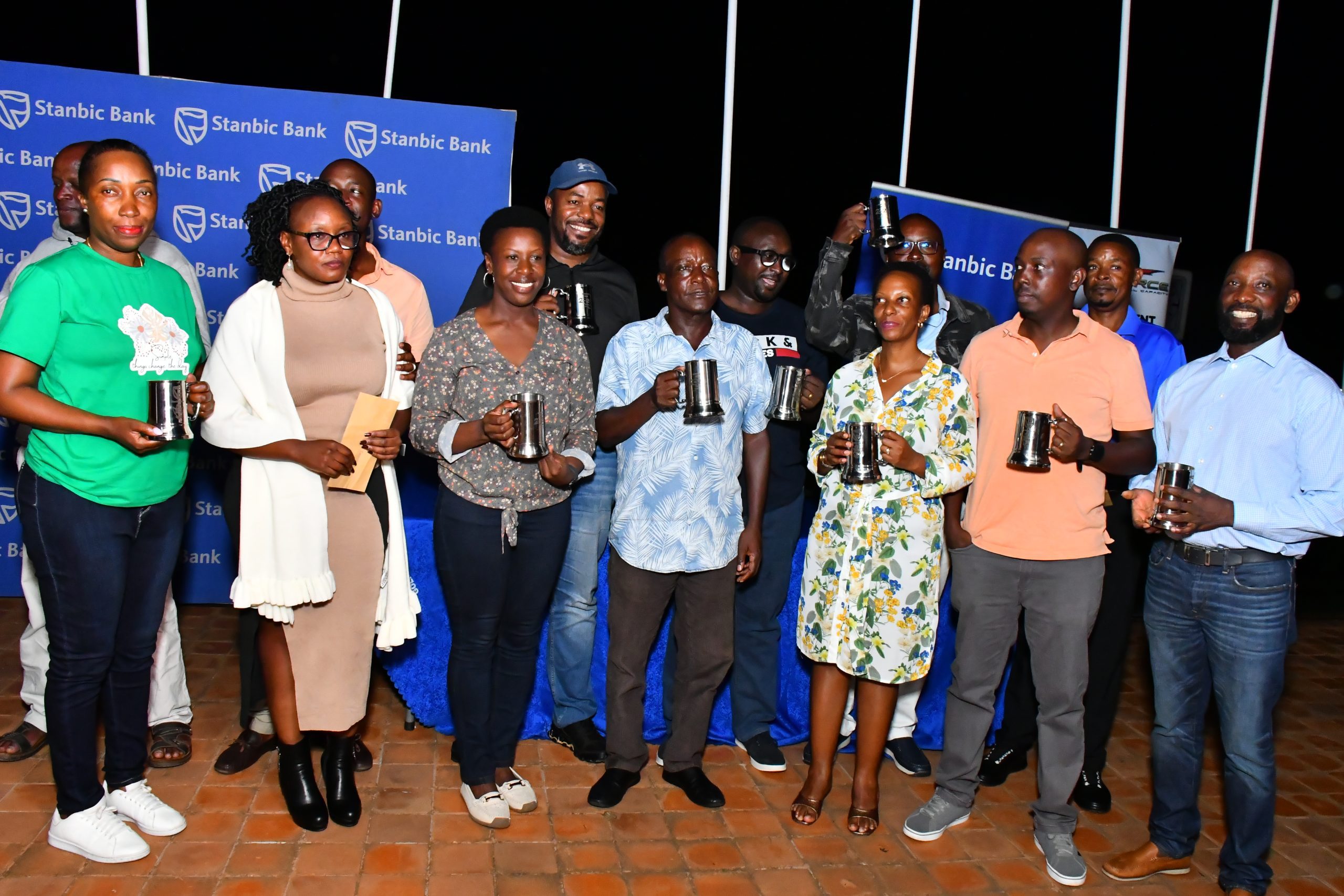 Mwenda Wins Stanbic April Mug at UGC as Kenyan Ambassador Owinow Signs Out